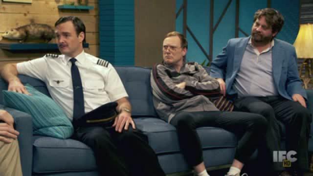 Zach Galifianakis Wears a Blue Jacket & Red Socks