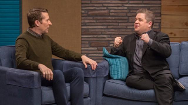 Patton Oswalt Wears a Black Blazer and Dress Shoes