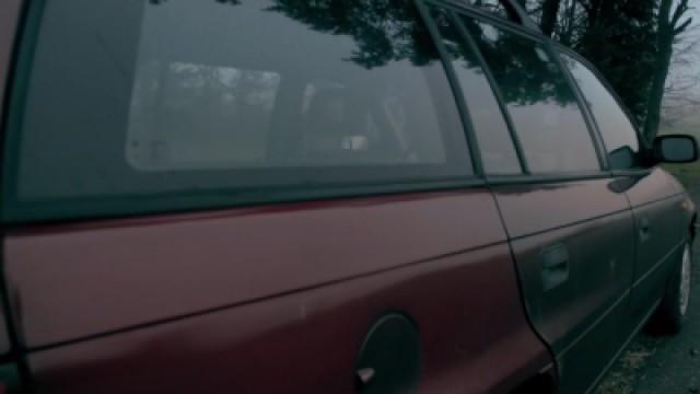 The man in the red car
