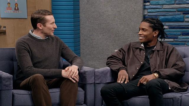 A$AP Rocky Wears a Black Button Up Jacket and Black Sneakers