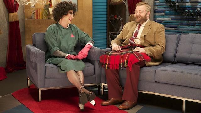 Robert Kirkman Wears a Tan Blazer and Red Suit Pants