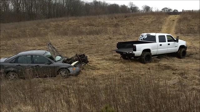 Tearing out a ford focus motor with my truck!!