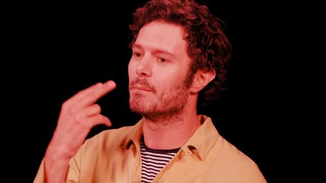 Adam Brody Surfs Through the Pain While Eating Spicy Wings